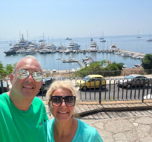 Olive & Stone's founders by a Corfu harbour